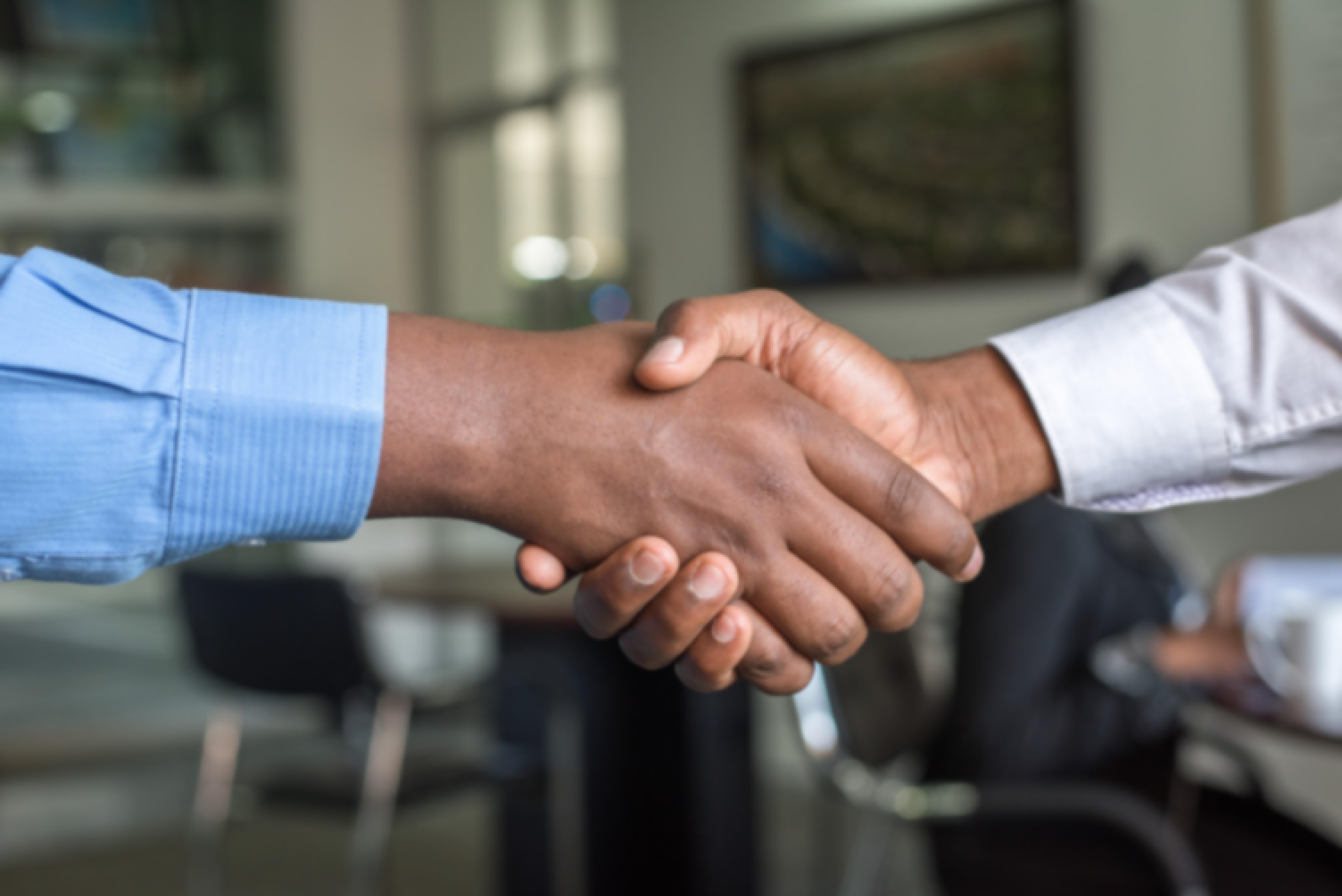 A partnership agreement hand shake